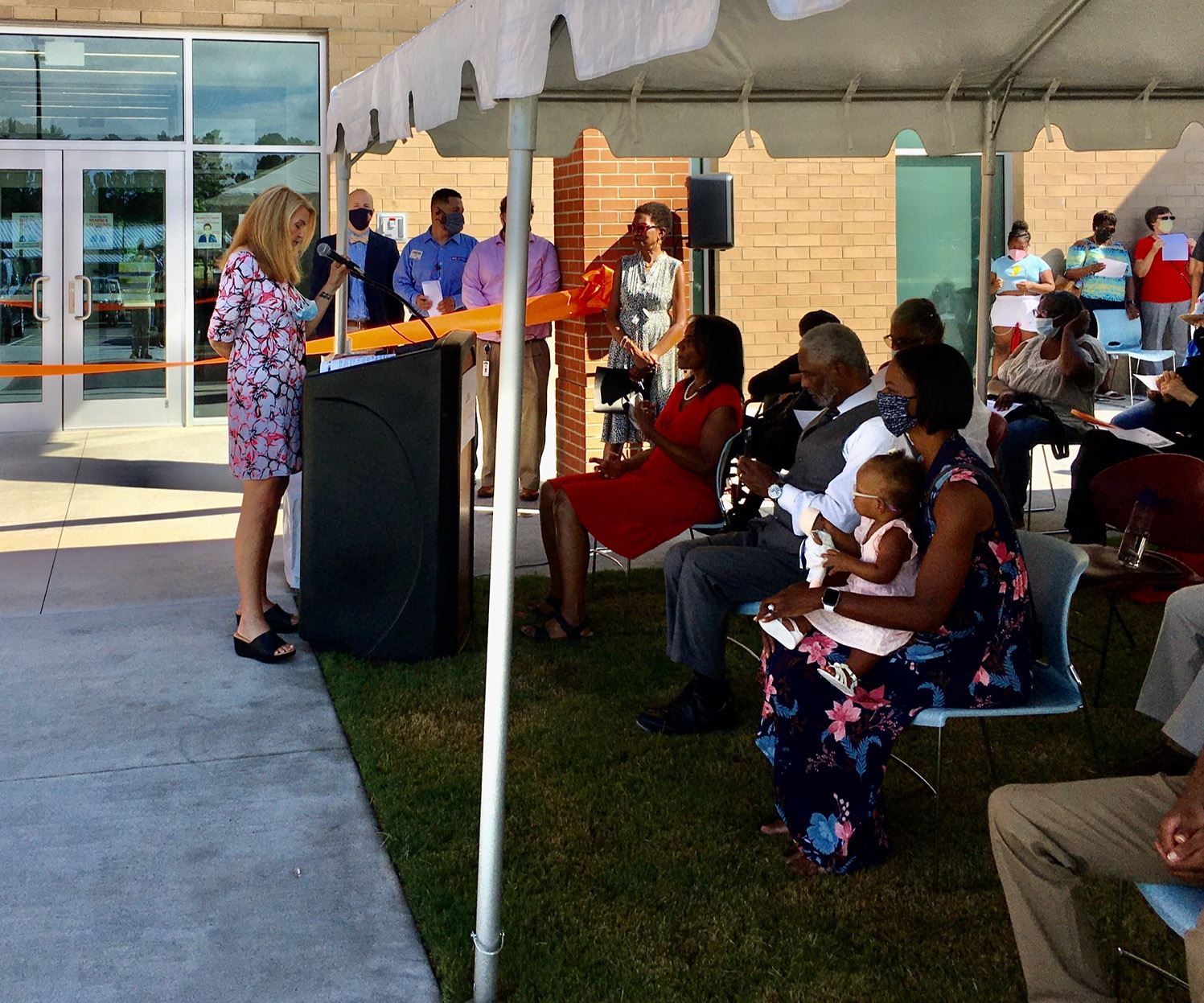Photo of crowd at ribbon cutting