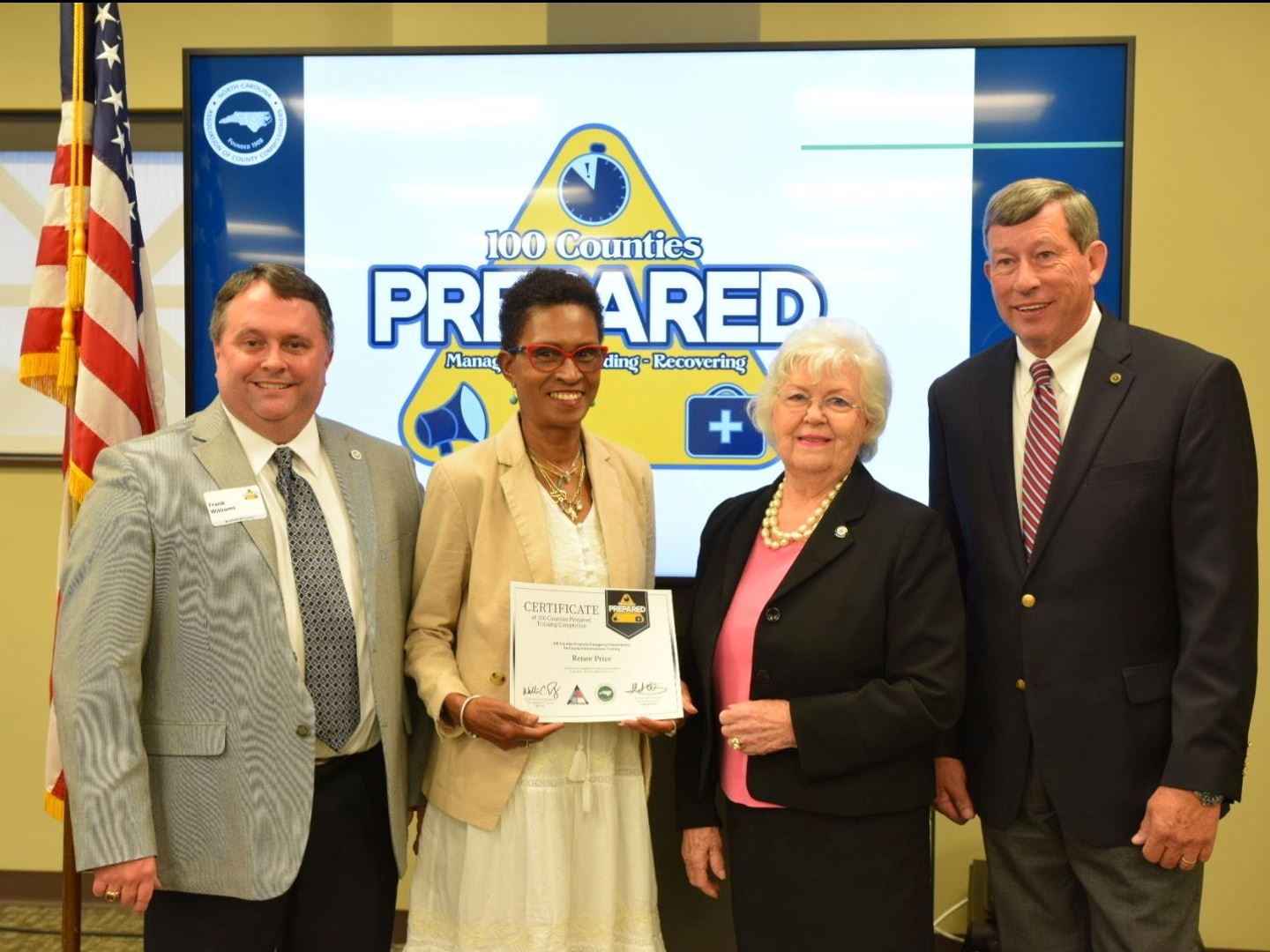 Commissioner Price receives certificate.