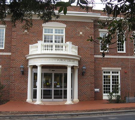 Two story county public library brick entrance