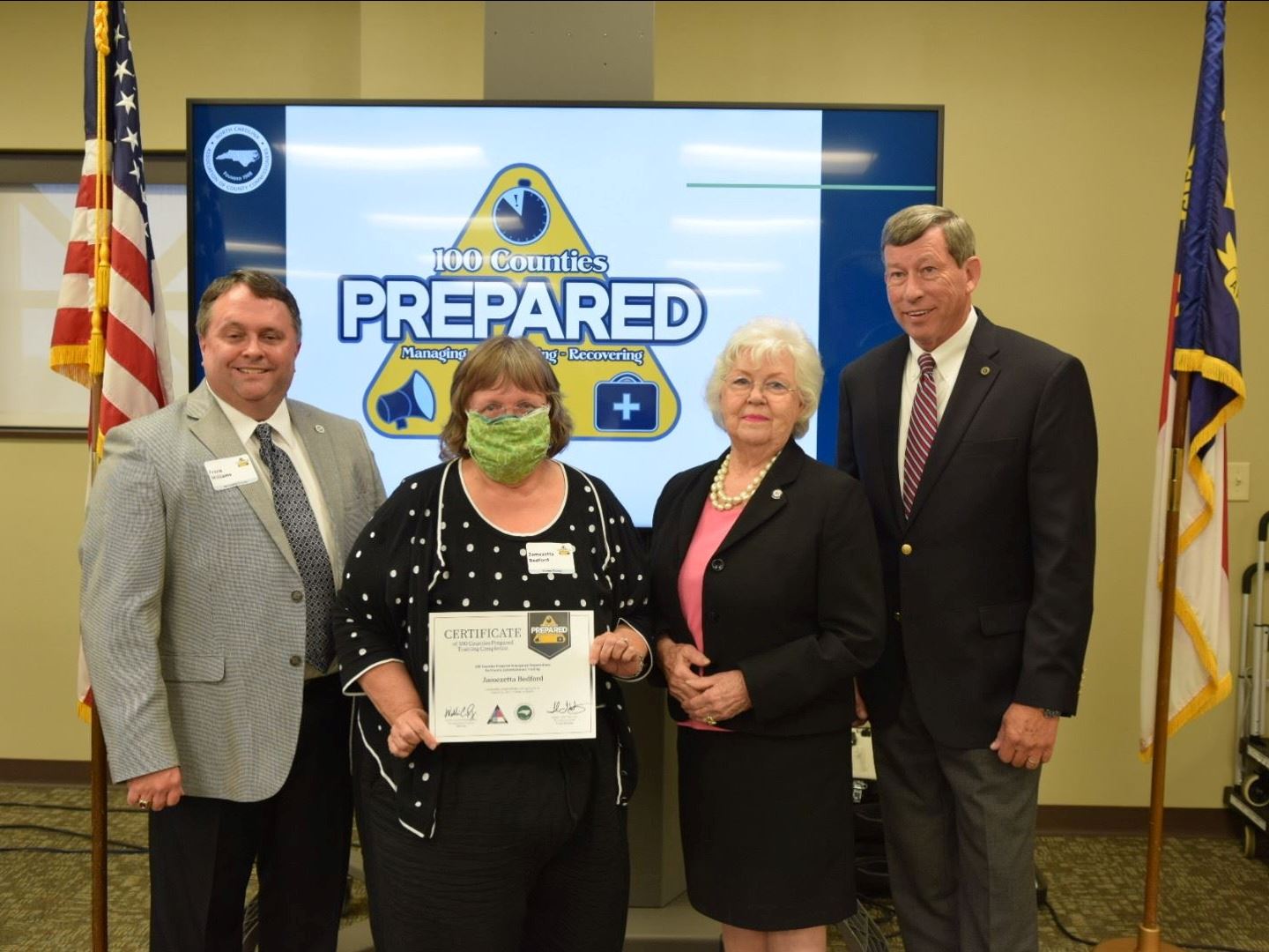 Commissioner Bedford receives certificate.