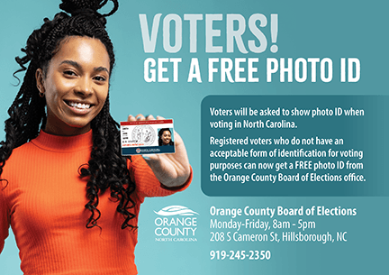 Woman holding photo ID. NC voters must show ID to vote. Free IDs at Orange County Board of Elections, 208 S Cameron St. Call 919-245-2350.