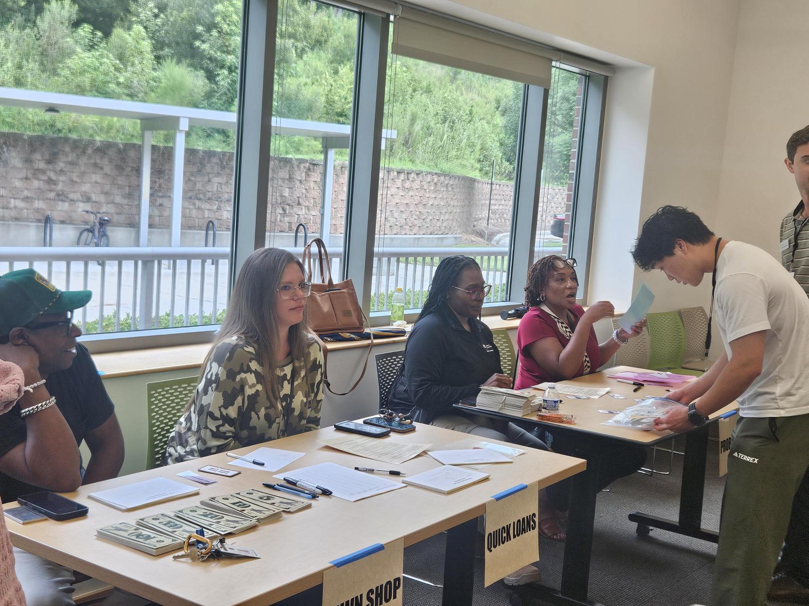 Intern Orion participating in a Reentry simulation at the Chapel Hill Public Library